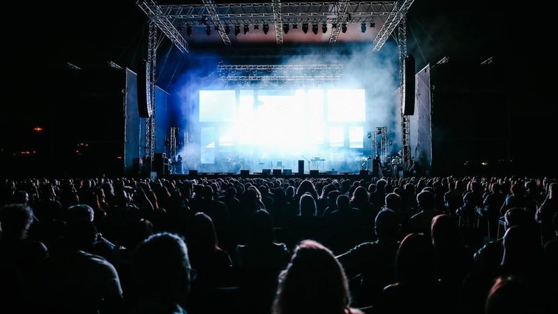 Large event crowd in front of a stage managed by accredited crowd controllers